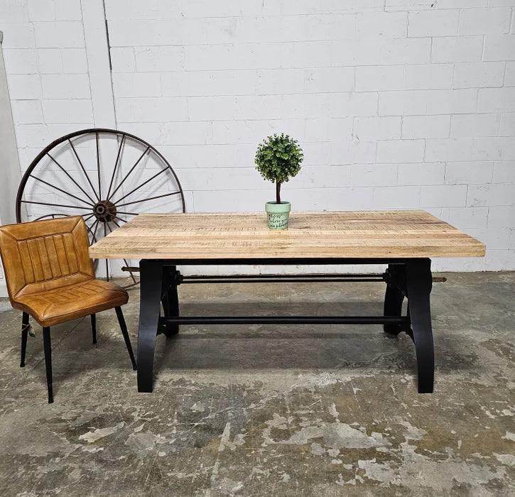 Crank dining table with matt black steel base and natural mango wood top