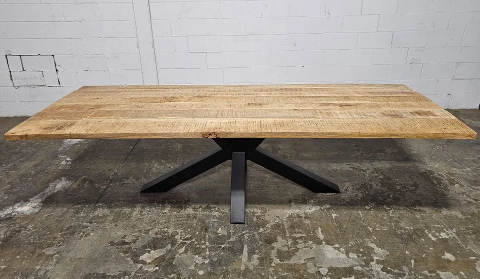 Spider dining table with matte black legs and extendable mango wood top