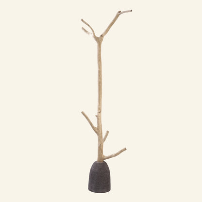 Coat hook made from a tree branch and a volcanic stone base - Robinson Collection