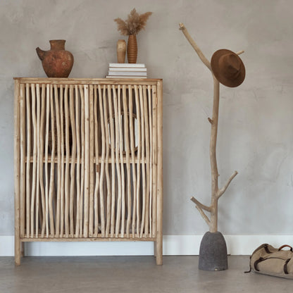 Coat hook made from a tree branch and a volcanic stone base - Robinson Collection